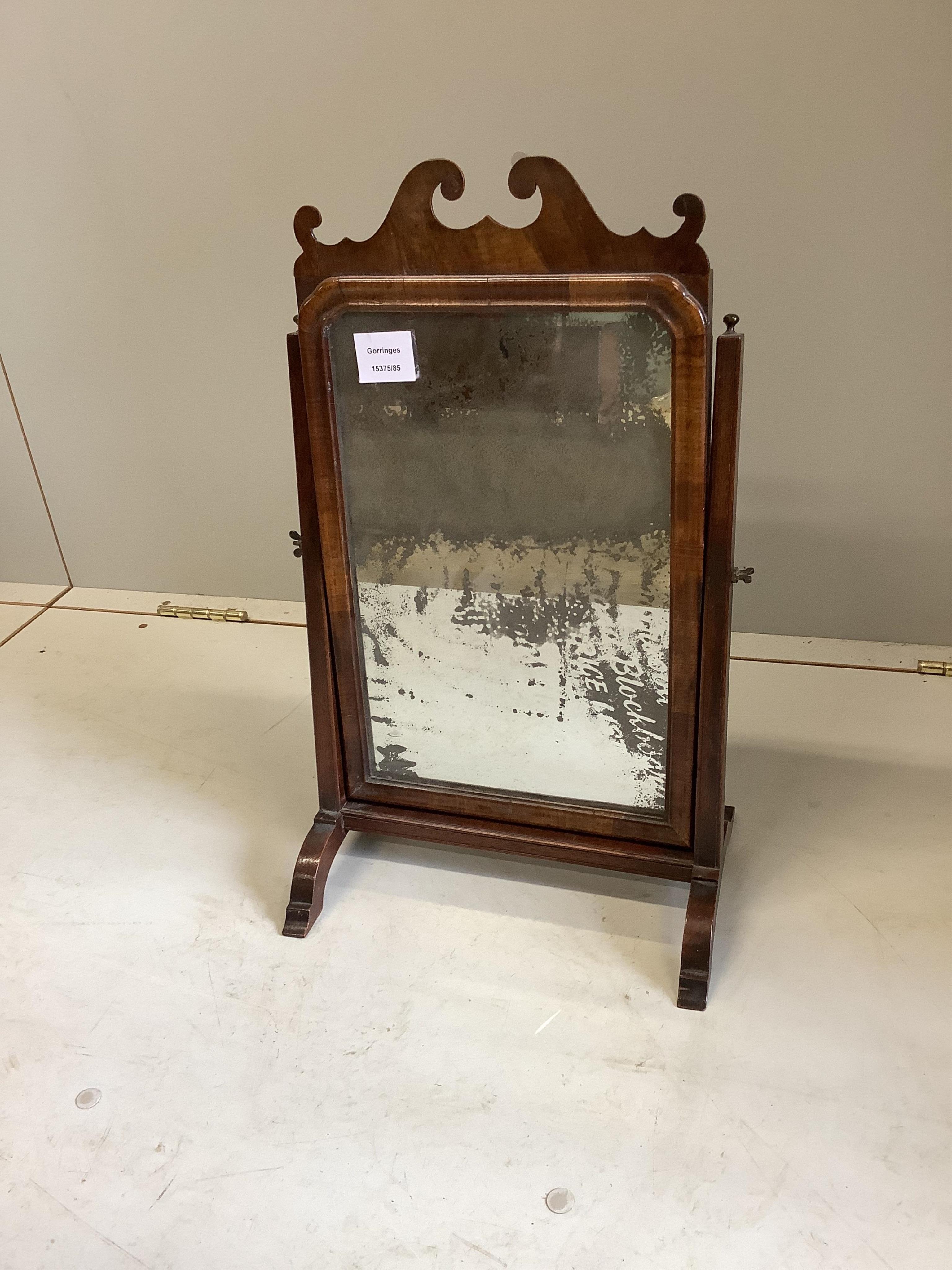 A George II walnut toilet mirror, width 31cm, height 51cm. Condition - fair